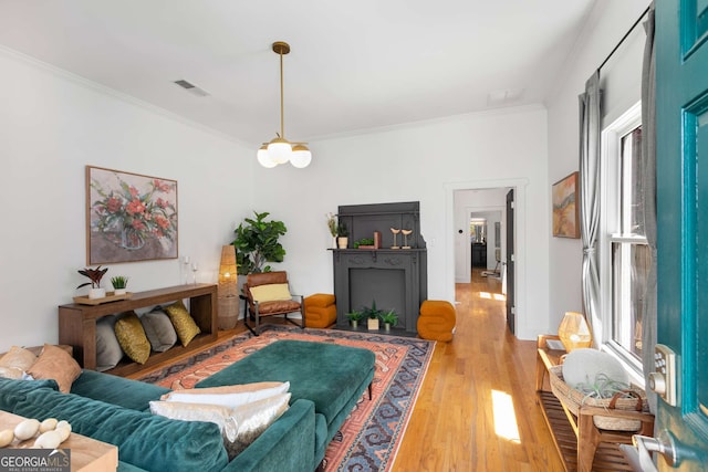 69 Hogue St NE, Atlanta, GA 30312 - living room with crown molding and light wood-style flooring