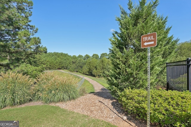 view of community featuring a forest view