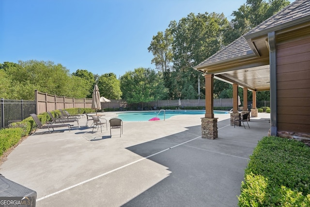 exterior space with a patio area, a fenced backyard, and a fenced in pool