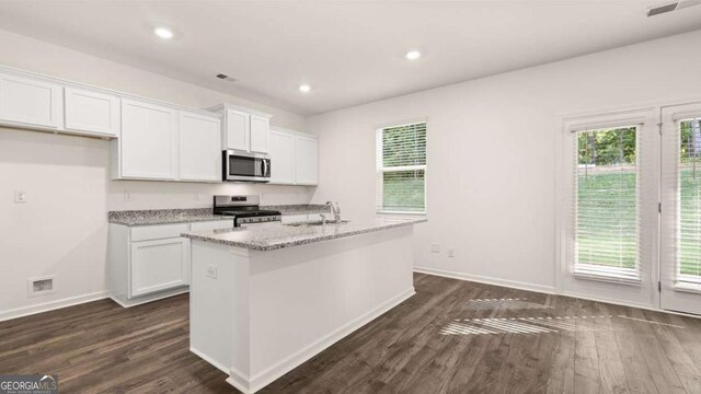 1416 Clear Pond Ln, Dacula, GA 30019 - kitchen featuring stainless steel appliances, a sink, white cabinets, dark wood-type flooring, and recessed lighting