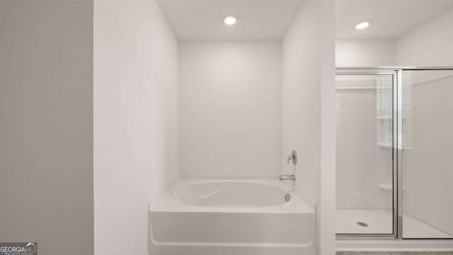 1416 Clear Pond Ln, Dacula, GA 30019 - full bathroom featuring a stall shower, a bath, and recessed lighting