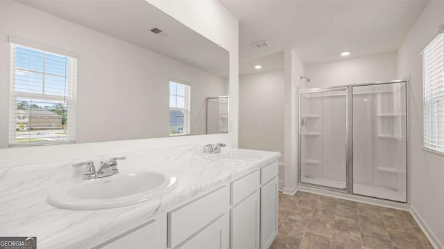 1416 Clear Pond Ln, Dacula, GA 30019 - bathroom with a shower stall, double vanity, baseboards, recessed lighting, and stone finish flooring