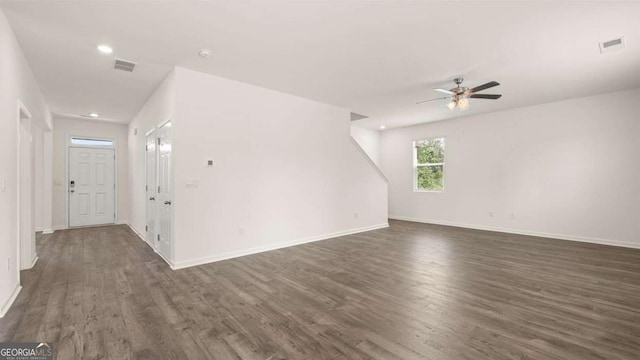 1416 Clear Pond Ln, Dacula, GA 30019 - unfurnished living room with dark wood finished floors, a ceiling fan, baseboards, and recessed lighting