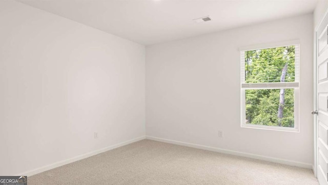 1416 Clear Pond Ln, Dacula, GA 30019 - spare room featuring light carpet and baseboards