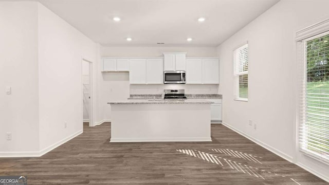 1416 Clear Pond Ln, Dacula, GA 30019 - kitchen featuring stainless steel appliances, white cabinets, baseboards, dark wood-type flooring, and recessed lighting