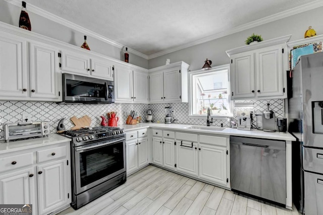 2820 Ashton Tree Ct, Dacula, GA 30019 - kitchen with light countertops, a sink, white cabinetry, and appliances with stainless steel finishes