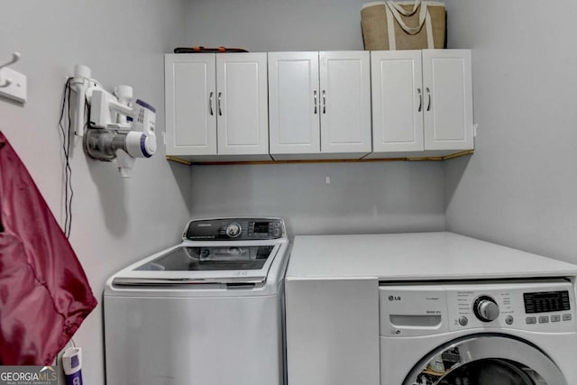 2820 Ashton Tree Ct, Dacula, GA 30019 - washroom featuring independent washer and dryer and cabinet space