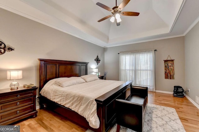 2820 Ashton Tree Ct, Dacula, GA 30019 - bedroom with a raised ceiling, baseboards, a ceiling fan, and light wood-type flooring