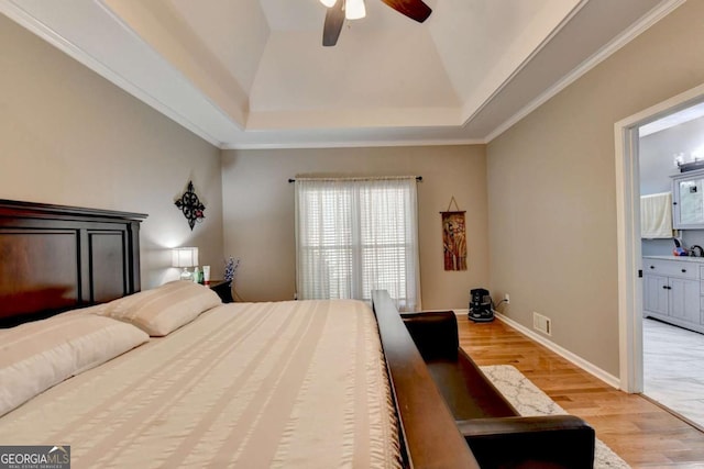 2820 Ashton Tree Ct, Dacula, GA 30019 - bedroom with light wood finished floors, a tray ceiling, visible vents, a ceiling fan, and baseboards
