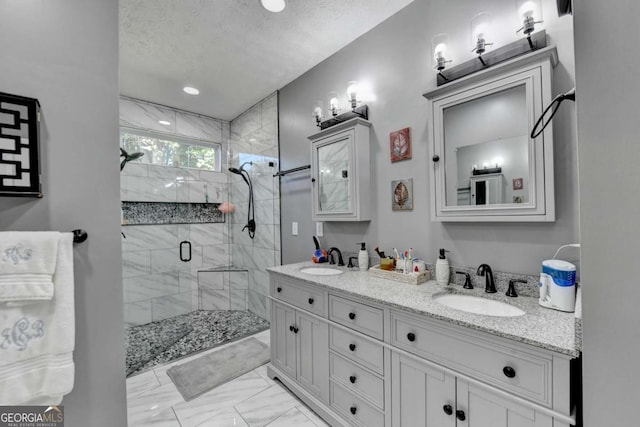 2820 Ashton Tree Ct, Dacula, GA 30019 - bathroom with double vanity, a shower stall, marble finish floor, and a sink