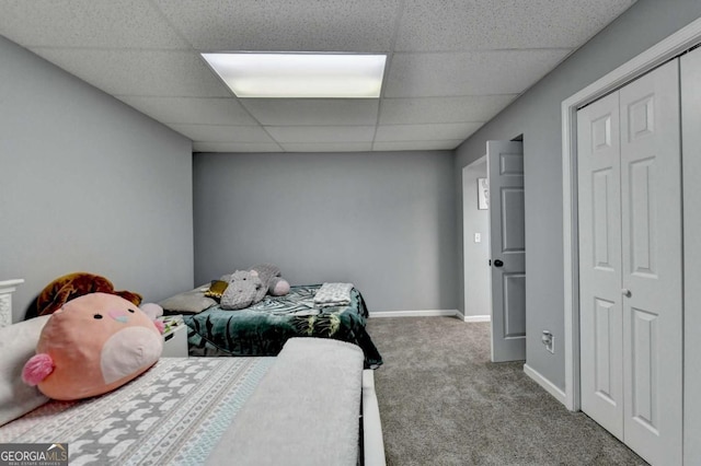 2820 Ashton Tree Ct, Dacula, GA 30019 - bedroom with baseboards, a paneled ceiling, carpet flooring, and a closet