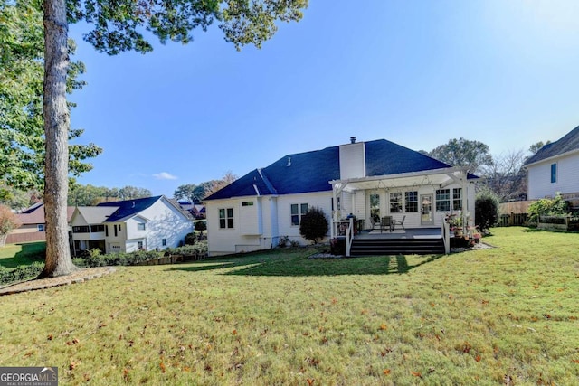 2820 Ashton Tree Ct, Dacula, GA 30019 - back of house featuring fence, a chimney, a yard, and a deck