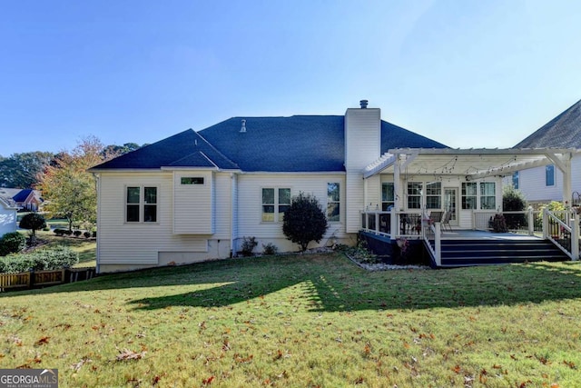 2820 Ashton Tree Ct, Dacula, GA 30019 - back of property with a chimney, a pergola, a yard, and a deck