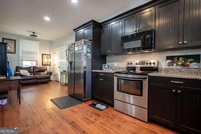 15 Chestnut Oak Run, Athens, GA 30607 - kitchen featuring recessed lighting, light stone counters, a sink, light wood-style floors, and appliances with stainless steel finishes