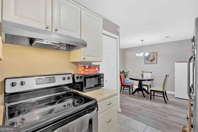 992 Old Holcomb Bridge Rd, Roswell, GA 30076 - kitchen featuring white cabinets, under cabinet range hood, black microwave, a chandelier, and stainless steel electric range oven