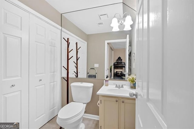 992 Old Holcomb Bridge Rd, Roswell, GA 30076 - bathroom with toilet, vanity, a chandelier, and visible vents