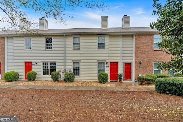 992 Old Holcomb Bridge Rd, Roswell, GA 30076 - exterior space with a chimney