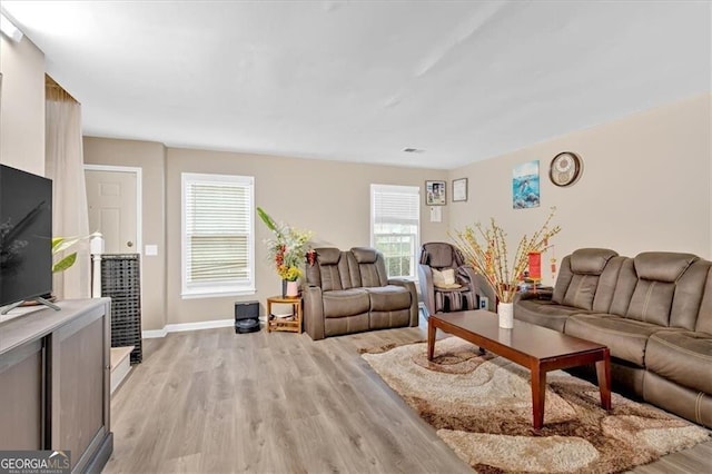 992 Old Holcomb Bridge Rd, Roswell, GA 30076 - living area with baseboards and light wood finished floors