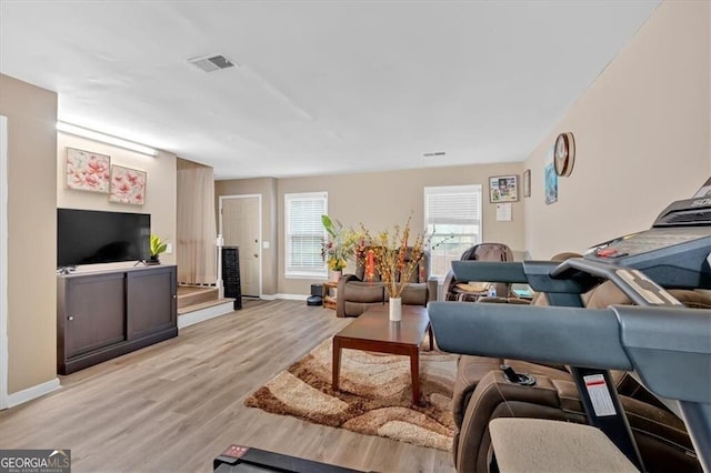 992 Old Holcomb Bridge Rd, Roswell, GA 30076 - living room featuring light wood finished floors, baseboards, and visible vents