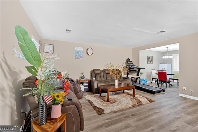 992 Old Holcomb Bridge Rd, Roswell, GA 30076 - living room with visible vents, baseboards, wood finished floors, and a chandelier