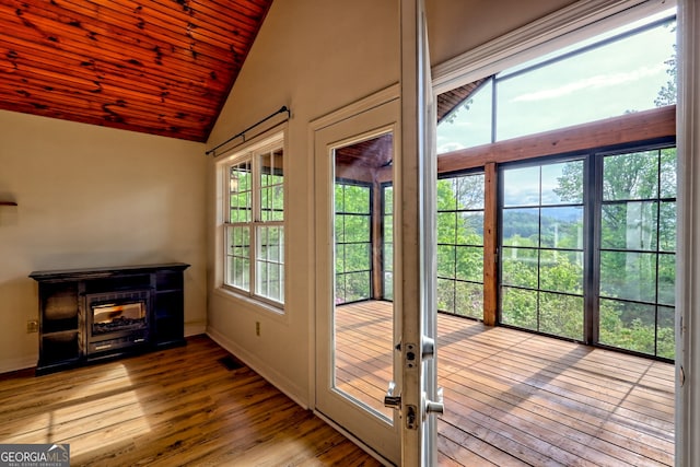 entryway with wood-type flooring, wood ceiling, baseboards, and french doors
