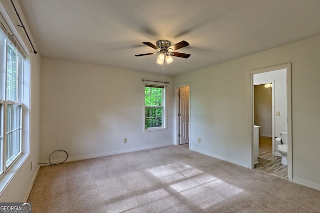 unfurnished bedroom with carpet flooring and baseboards