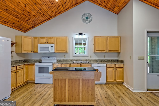kitchen with a sink, high vaulted ceiling, white appliances, and light wood-style flooring