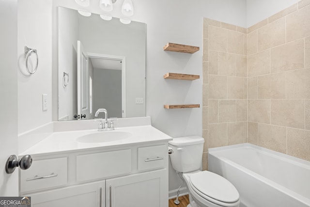 bathroom featuring shower / bath combination, vanity, and toilet