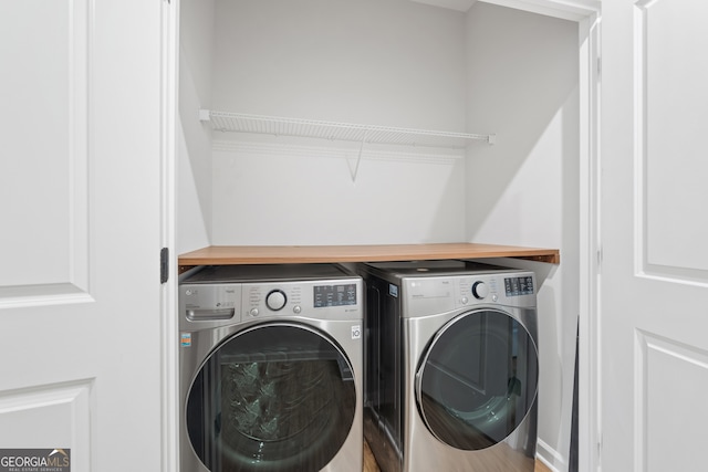 washroom with washer and clothes dryer