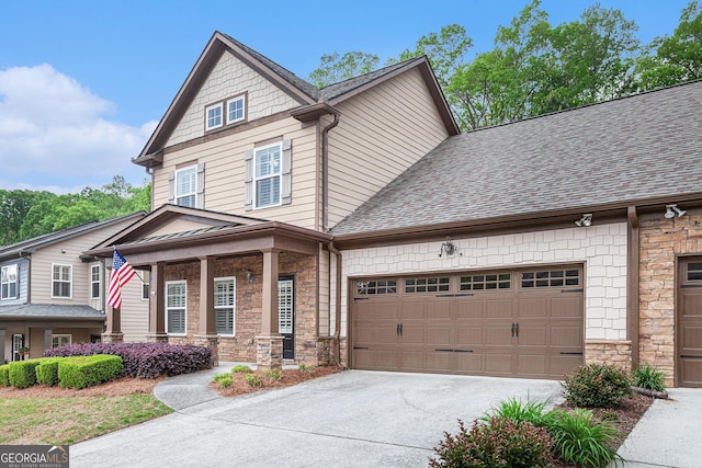 craftsman inspired home featuring covered porch, stone siding, a shingled roof, concrete driveway, and an attached garage