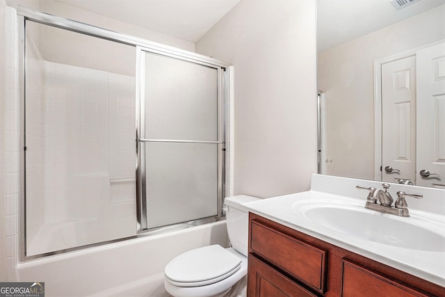 full bath with vanity, combined bath / shower with glass door, and toilet