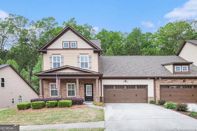 craftsman house with a shingled roof, an attached garage, stone siding, a porch, and driveway