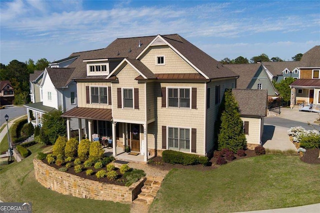 2601 Boulder Way, Woodstock, GA 30188 - view of front of home featuring a standing seam roof, a front yard, and metal roof