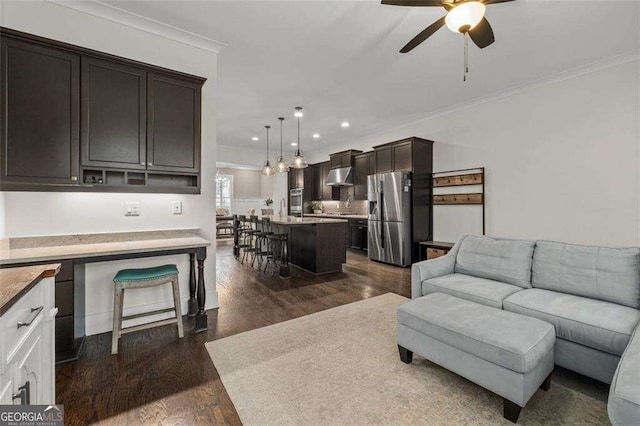 2601 Boulder Way, Woodstock, GA 30188 - living room with a ceiling fan, crown molding, dark wood-style floors, and recessed lighting