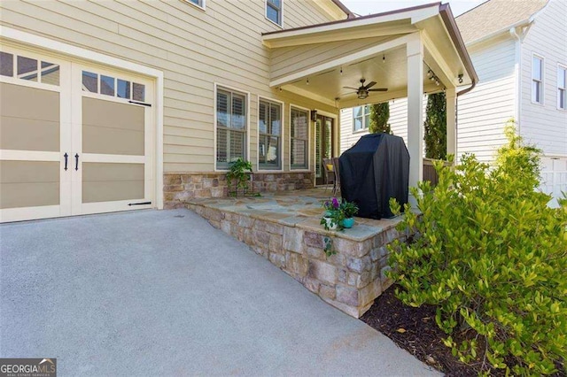 2601 Boulder Way, Woodstock, GA 30188 - view of patio with a garage, a grill, ceiling fan, and asphalt driveway