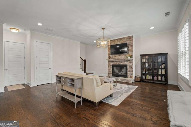 2601 Boulder Way, Woodstock, GA 30188 - living area with a stone fireplace, wood finished floors, recessed lighting, stairway, and crown molding