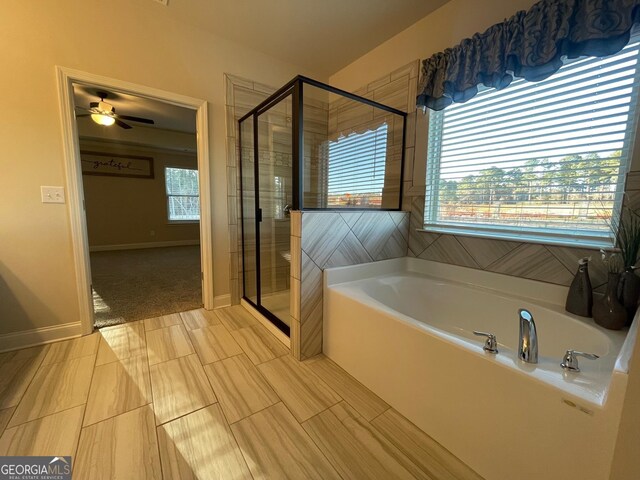 3708 Southfield Ct Unit 43A, Loganville, GA 30052 - full bath with a bath, a stall shower, and a ceiling fan