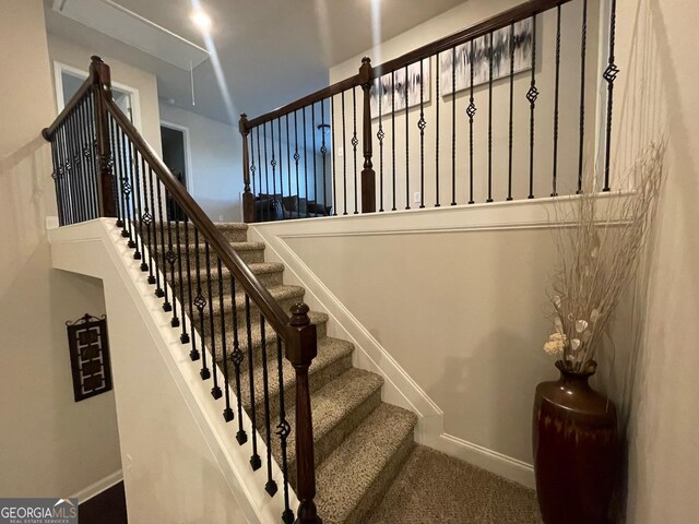 3708 Southfield Ct Unit 43A, Loganville, GA 30052 - stairway featuring baseboards and carpet