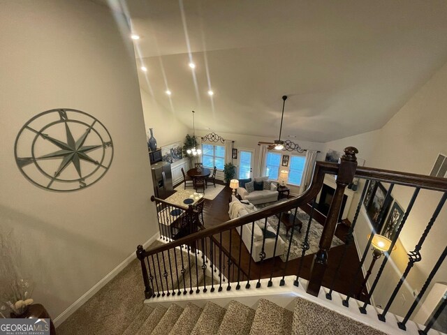 3708 Southfield Ct Unit 43A, Loganville, GA 30052 - stairs featuring carpet floors, vaulted ceiling, and ceiling fan