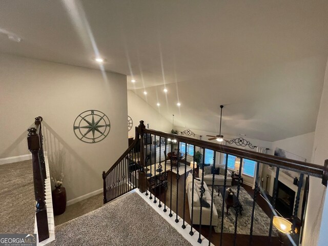 3708 Southfield Ct Unit 43A, Loganville, GA 30052 - stairway featuring carpet flooring, lofted ceiling, ceiling fan, recessed lighting, and a fireplace