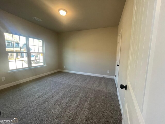 3708 Southfield Ct Unit 43A, Loganville, GA 30052 - spare room featuring dark carpet