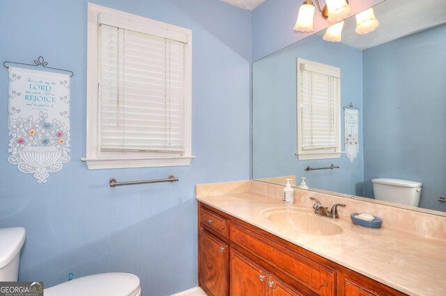 3740 Laurel Brook Way, Snellville, GA 30039 - bathroom with toilet, vanity, and baseboards