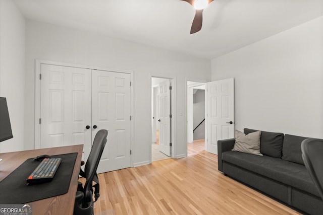 office with ceiling fan and light wood finished floors
