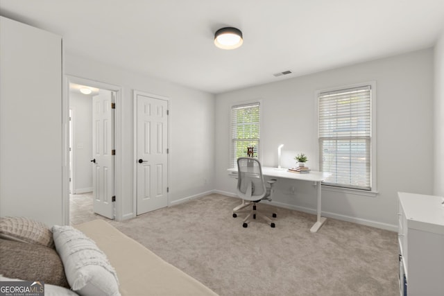 office area with light colored carpet and baseboards