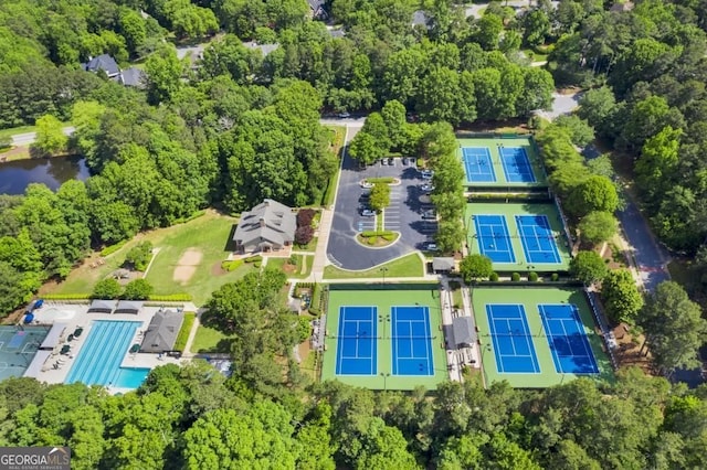 aerial view of property and surrounding area featuring a pool
