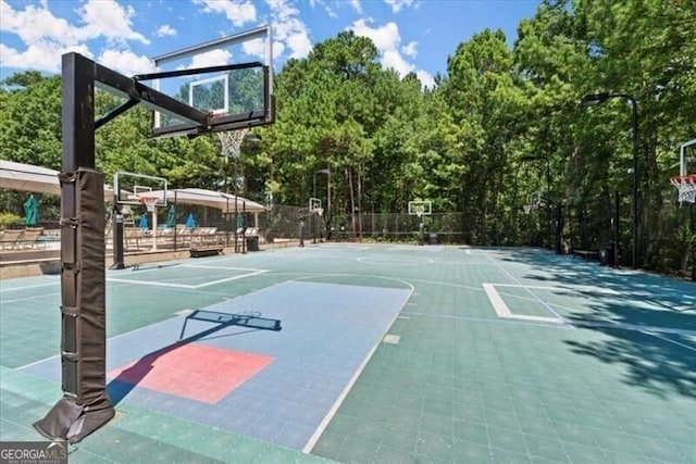 view of sport court with community basketball court and fence