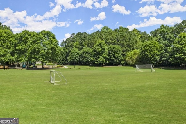 surrounding community featuring an area for soccer
