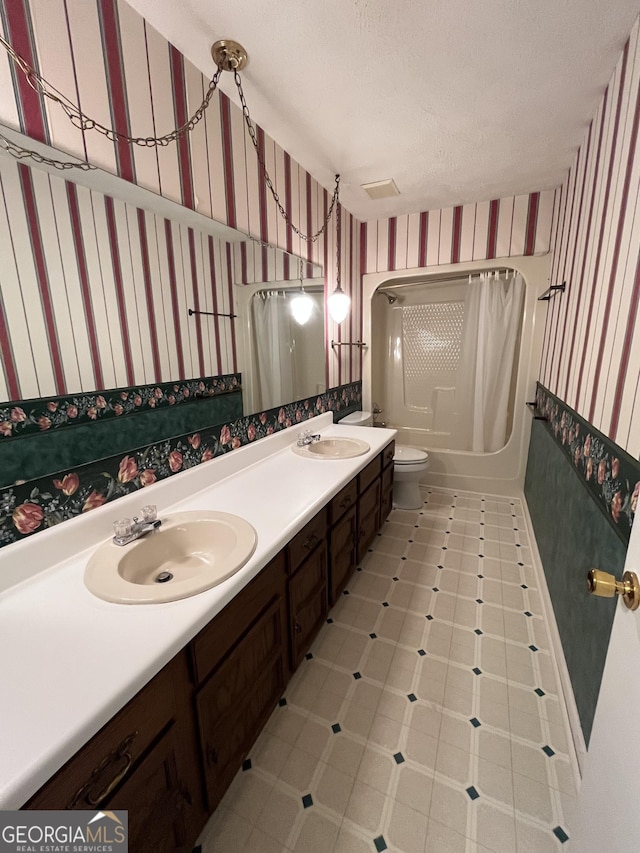 120 Treeside Dr NW, Rome, GA 30165 - bathroom featuring wallpapered walls, double vanity, shower / bath combo with shower curtain, and a sink