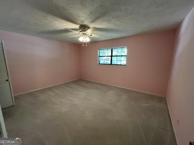 120 Treeside Dr NW, Rome, GA 30165 - spare room featuring light carpet, baseboards, a textured ceiling, and ceiling fan