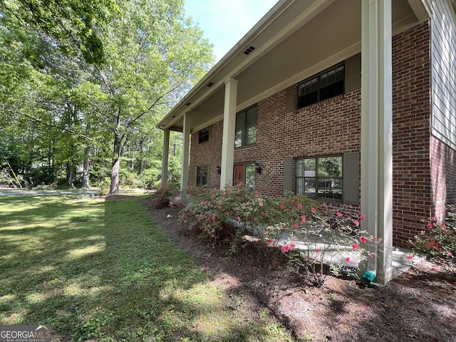 120 Treeside Dr NW, Rome, GA 30165 - view of home's exterior featuring brick siding and a lawn